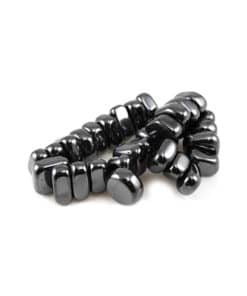 A set of sleek, black magnetic hematite stones stacked in a pattern, perfect for any witchy or metaphysical shop.