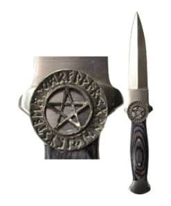 a grey athame with a pentacle surrounded by runes above the handle