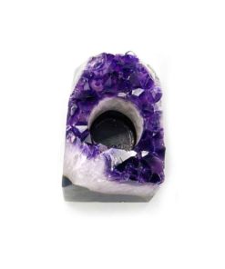 A dark, deep purple crystal candle holder