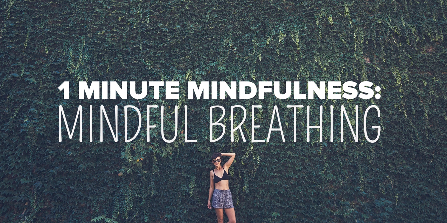 A woman practicing spiritual mindfulness against a backdrop of lush greenery with a reminder to engage in mindful breathing for one minute.