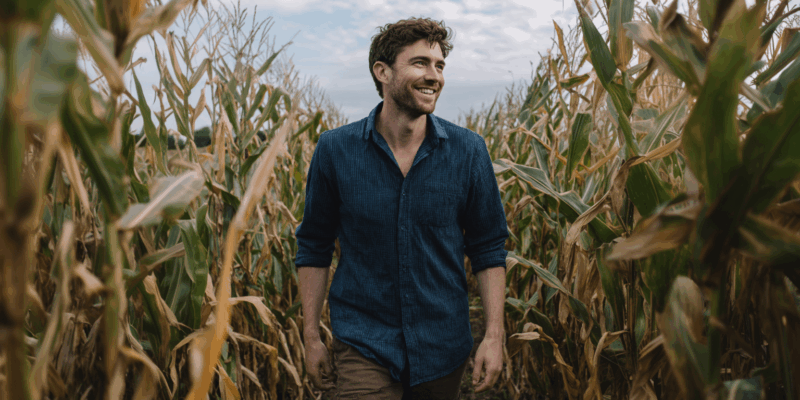 a man in a corn field to practice mindful walking meditation