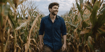 5 Mindfulness Exercises For Stress Management: Simple Tools Backed By Science 4 a man in a corn field practicing mindful walking meditation