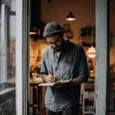 The 5 Real Benefits of Gratitude Practice (For Sensitive, Spiritual Souls) 6 Man opening a journal