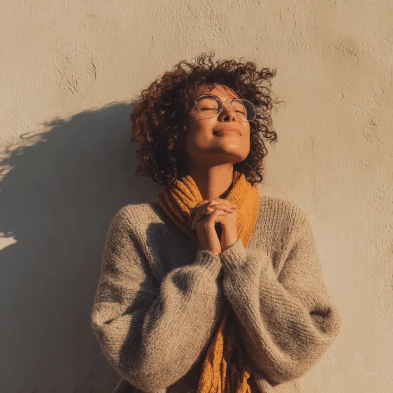 The 5 Real Benefits of Gratitude Practice (For Sensitive, Spiritual Souls) 3 A woman grounding through gratitude practice