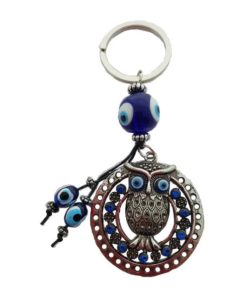 A round owl keychain with evil eye glass beads