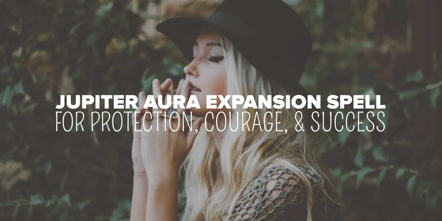 A pensive woman in a hat with her eyes closed, set against a backdrop of greenery, overlaid with text promoting an "occult Jupiter aura expansion spell for protection, courage, & success