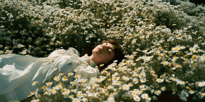 Chamomile Relaxation and Empowerment Guided Meditation Script 1 a woman lying in a field of flowers