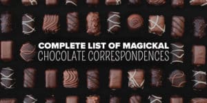 Magickal Properties of Chocolate 1 An assortment of gourmet chocolates, each with unique decorative designs, is elegantly displayed with the text "complete list of metaphysical chocolate correspondences" overlaying the image.