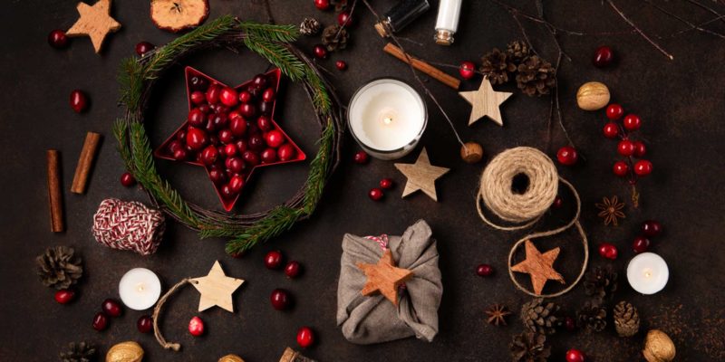 103 Yule Correspondences For An Amazing Winter Solstice Ritual 3 A yule winter solstice altar with cranberries, stars, white candles, cinnamon, and rope