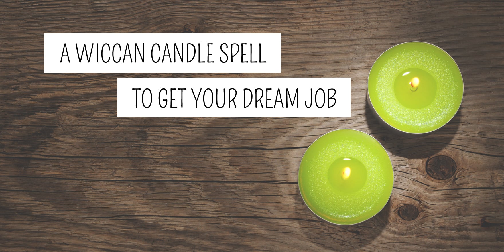 Two lit green candles on a wooden surface with text "a wiccan candle spell to get your dream job", available at our metaphysical shop.
