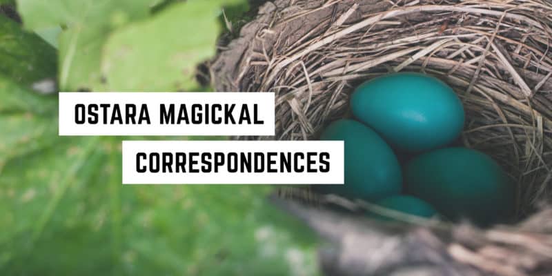 Ostara Magickal Correspondences 2 Three vibrant blue eggs nestled in a natural bird's nest among green foliage, with the caption "Ostara metaphysical correspondences" overlaying the image.