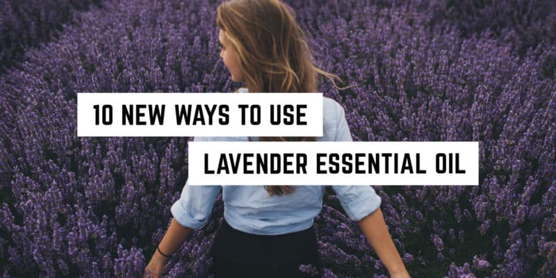 10 New Ways to Use Lavender Essential Oil 1 A woman lost in thought amidst a serene lavender field, pondering the metaphysical possibilities of the plants surrounding her.