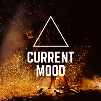Magical Witch Quotes for Empowerment, Wisdom & Inspiration 52 A silhouetted figure stands before a fiery backdrop with sparks flying around, overlaid with the bold text "current mood" inside a triangle, suggesting a feeling of intensity or turmoil in a metaph