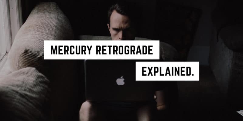 Mercury Retrograde Explained 8 A focused individual researching mercury retrograde in an occult library to demystify the astrological event.