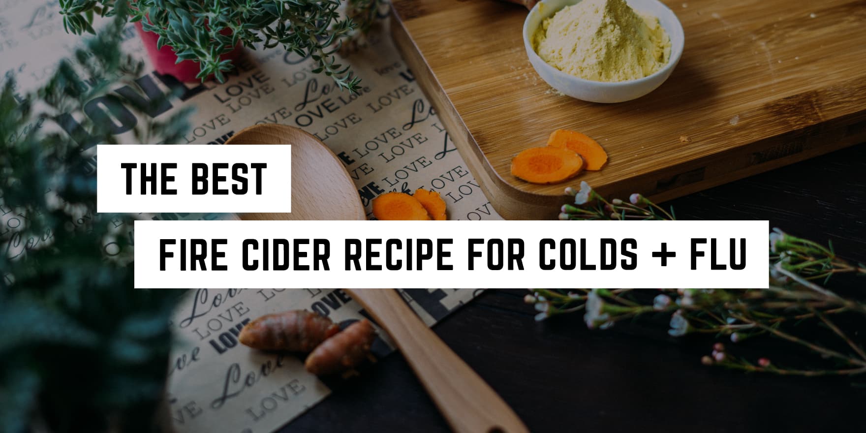 A cozy, witchy kitchen scene featuring ingredients for making a natural remedy, with the caption "the best fire cider recipe for colds + flu".