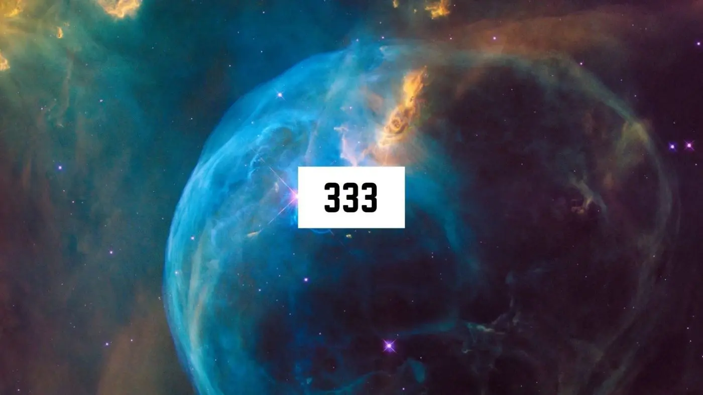 Angel Number 333 Numerology Meanings 1 A mesmerizing view of a celestial nebula, with vibrant blue and orange hues, showcasing the spiritual beauty of the cosmos.