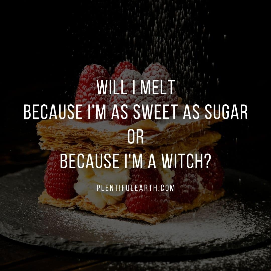 A delicious layered dessert with raspberries is sprinkled with powdered sugar, accompanied by a playful caption questioning the reason for melting - sweetness or new age witchery.
