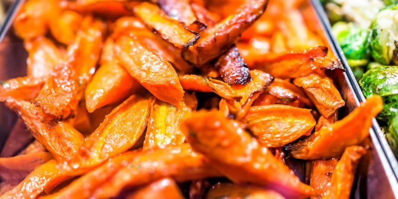 Dill Roasted Carrots for Wealth and Grounding 6 Savory roasted sweet potato wedges glistening with a caramelized glaze, offering a mouthwatering side dish imbued with new age product energies.