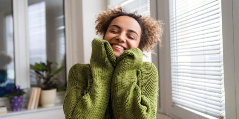 111 Positive Affirmations To Make You Happy In Every Situation 9 A woman in a green hoodie