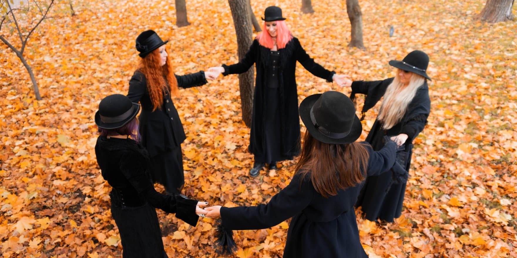 5 witches holding hands in a circle