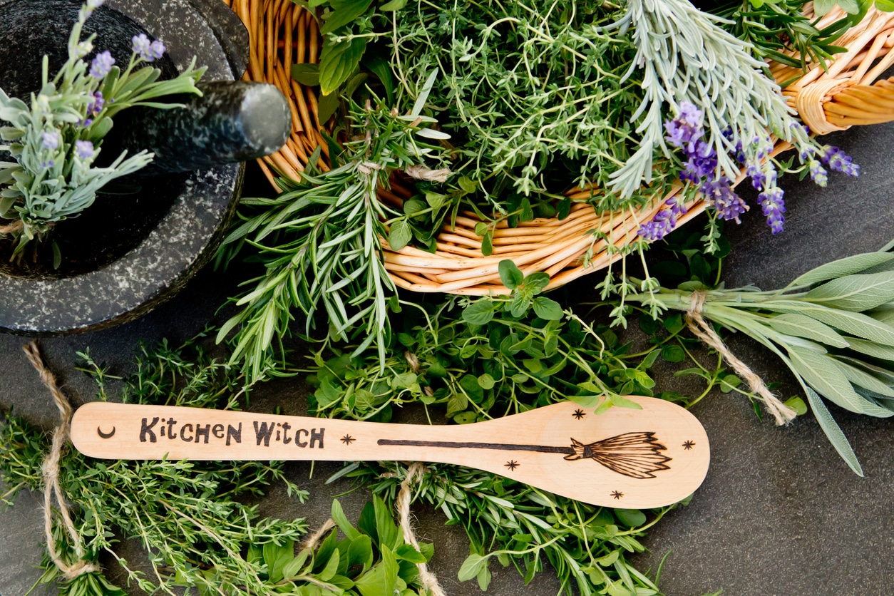 kitchen witch spoon and herbs