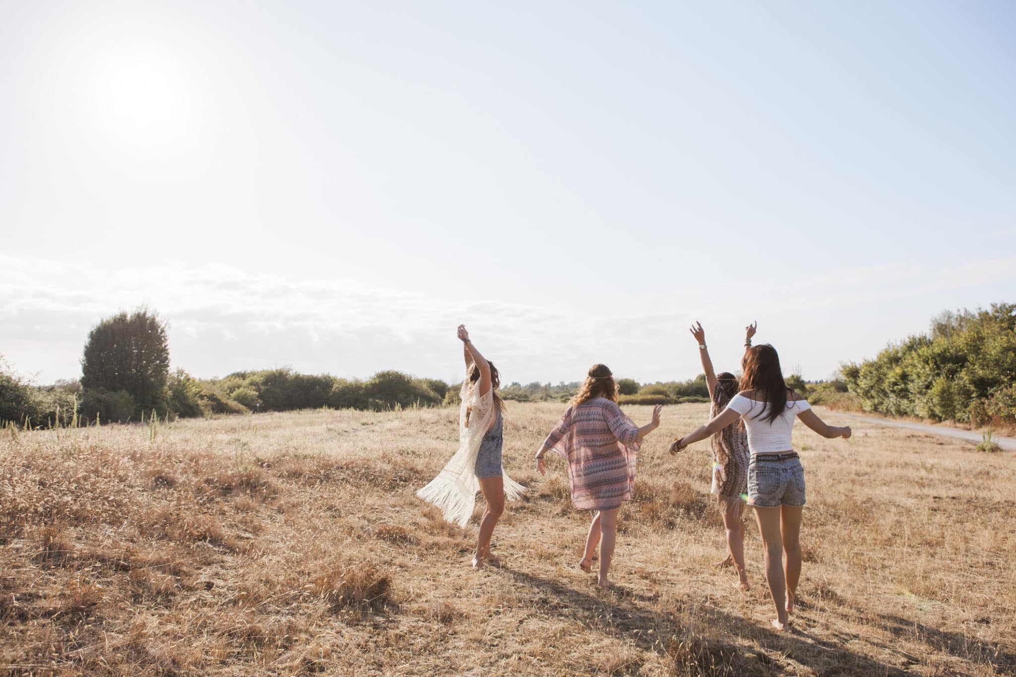 Carefree spiritual women in a field