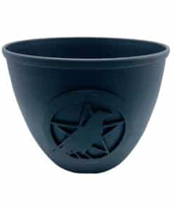 a black bowl candleholder with a crow and pentacle symbol on the side