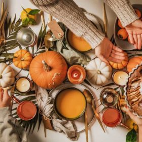 9 Fall Equinox Dishes For Your Mabon Feast | Mabon Recipes Guide 4 a table filled with pumpkins and mabon foods like pumpkin soup and apples