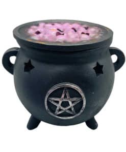 A black pentacle cauldron with purple bubbles on top and holes to allow incense smoke to rise through.