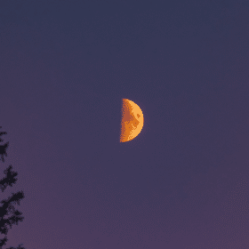 4 Ways To Use First Quarter Moons For Powerful Spiritual Growth 14 A beautiful first quarter moon against a purple twilight sky