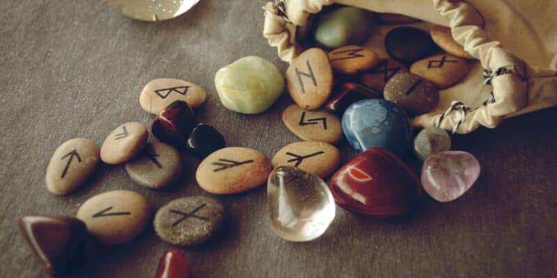 Rune Meanings: Getting To Know The Elder Futhark 1 A bag of runes and crystals