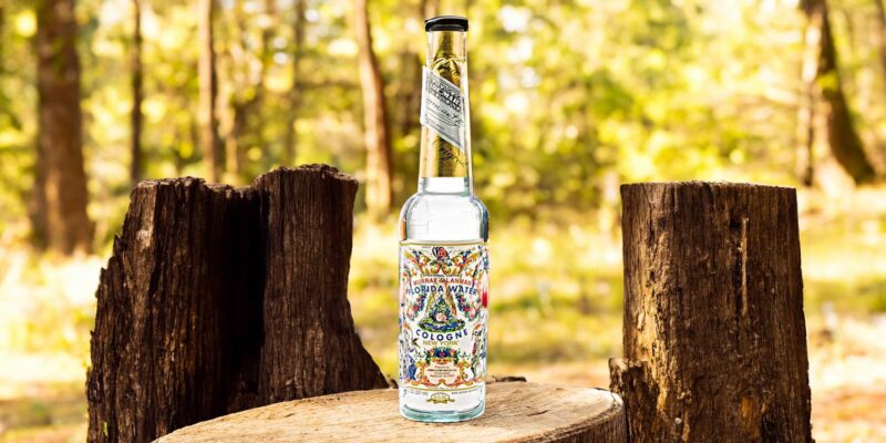 30 Spiritual Ways To Use Florida Water 3 A bottle of florida water sitting on a stump in nature