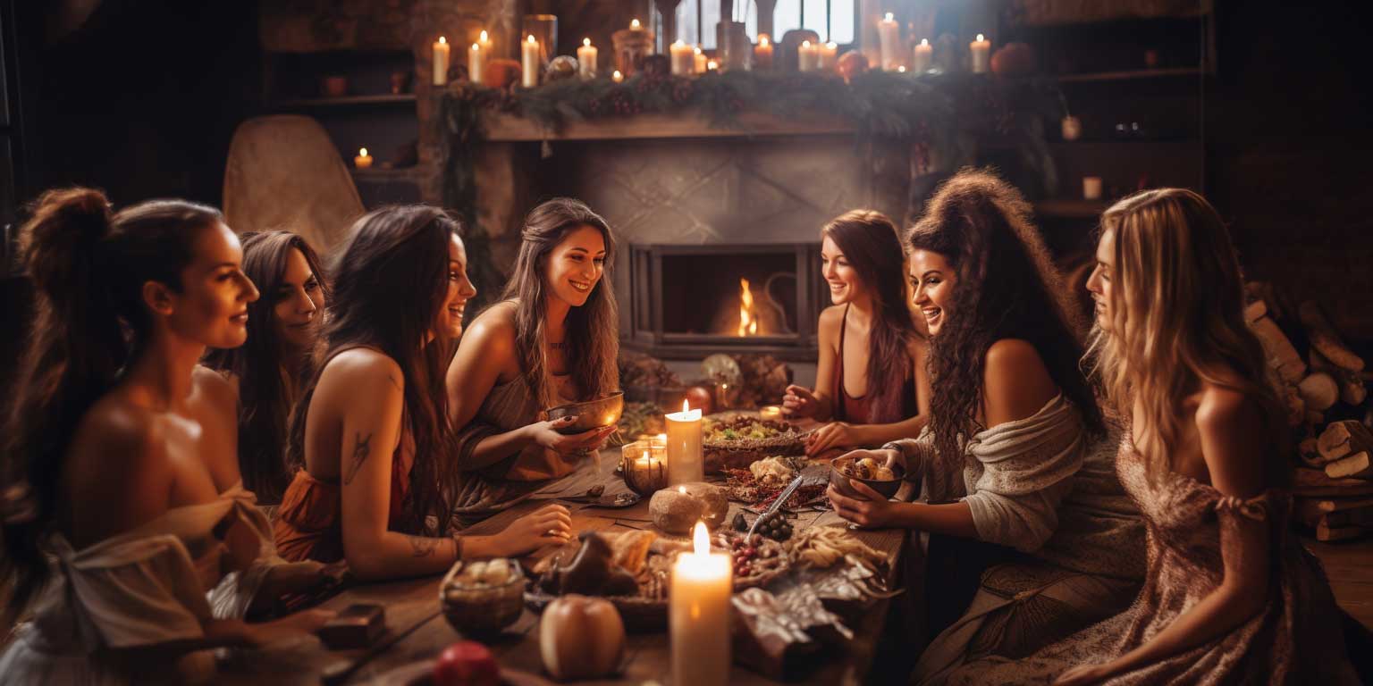 Group of friends enjoying a meal by firelight, celebrating winter solstice tradition.
