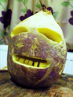 cornish swede jack o lantern Plentiful Earth | Global Spirituality A traditional Cornish jack-o'-lantern carved from a purple and yellow swede, with square eyes and a toothy grin.