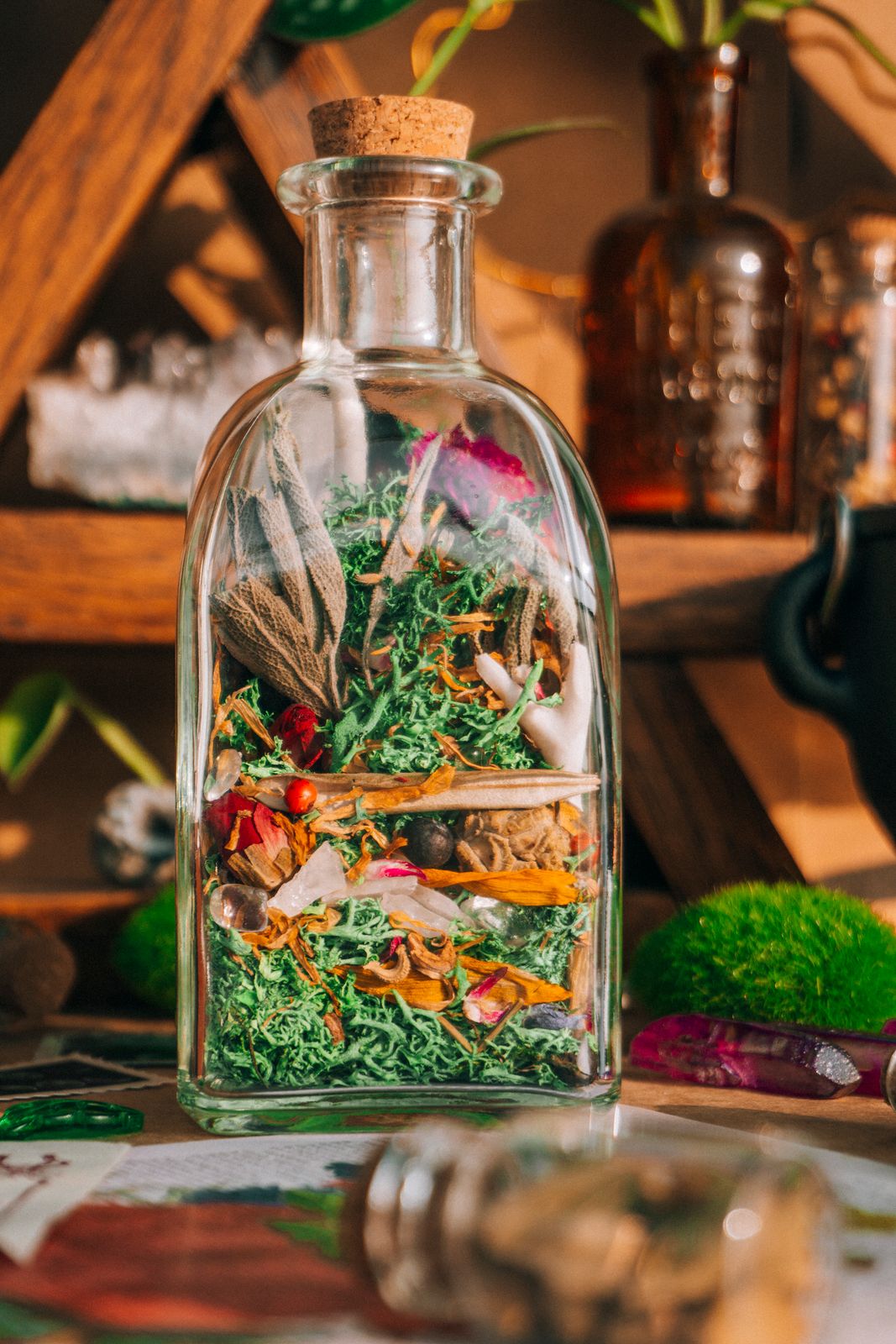 Protection spell jar with dried herbs Plentiful Earth | Global Spirituality A sealed glass spell jar layered with dried herbs and flowers