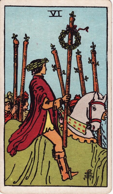 Six of Wands RiderWaiteSmith 1909 Plentiful Earth | Global Spirituality The Six of Wands tarot card from the 1909 Rider-Waite-Smith deck: a rider wearing a laurel wreath sits on a white horse draped in green, holding a staff topped with a second laurel wreath, while people on foot raise five more staves beside him