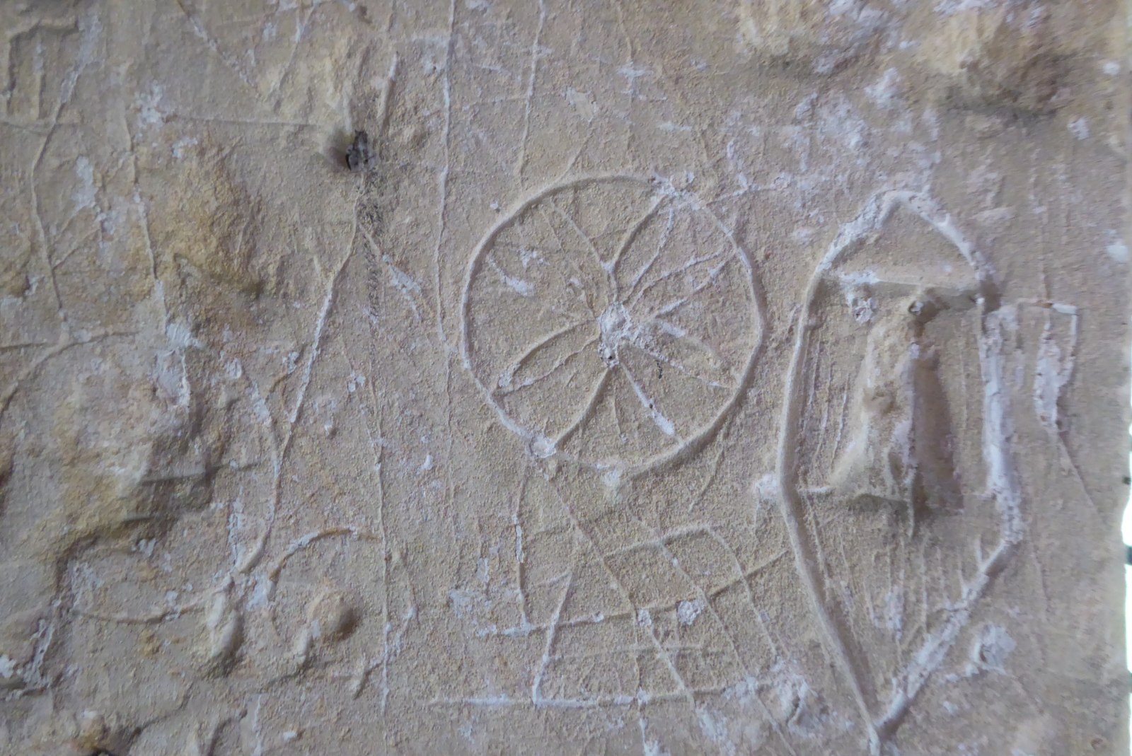 Witches marks Tredington church Plentiful Earth | Global Spirituality Old stone wall in Tredington church scratched with witch marks, including a circle divided like a daisy wheel